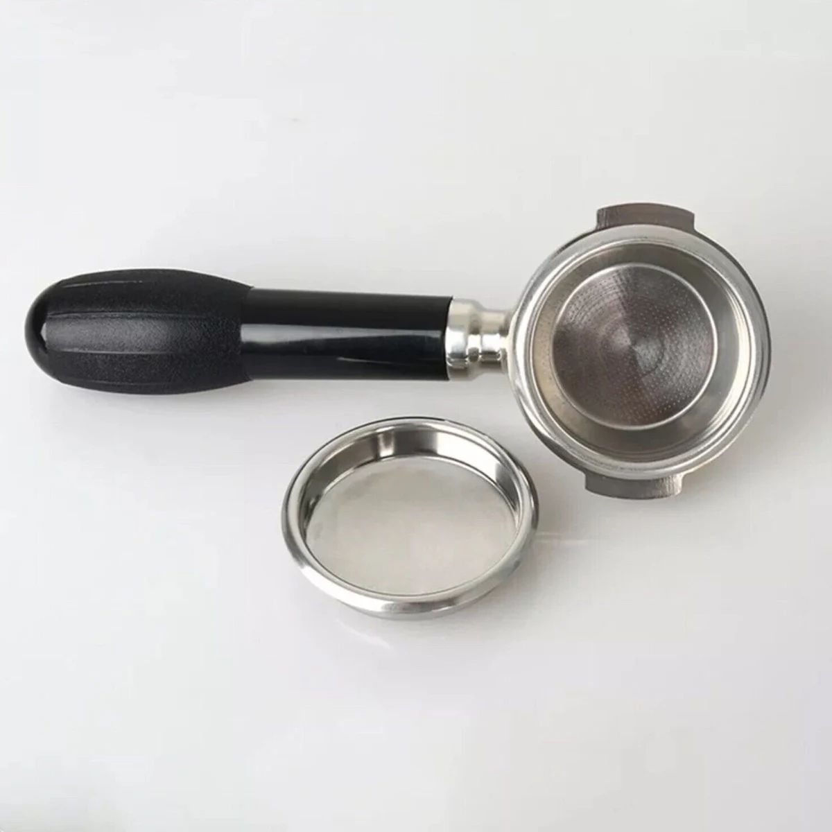58 mm Blind Filter Basket, next to a portafilter