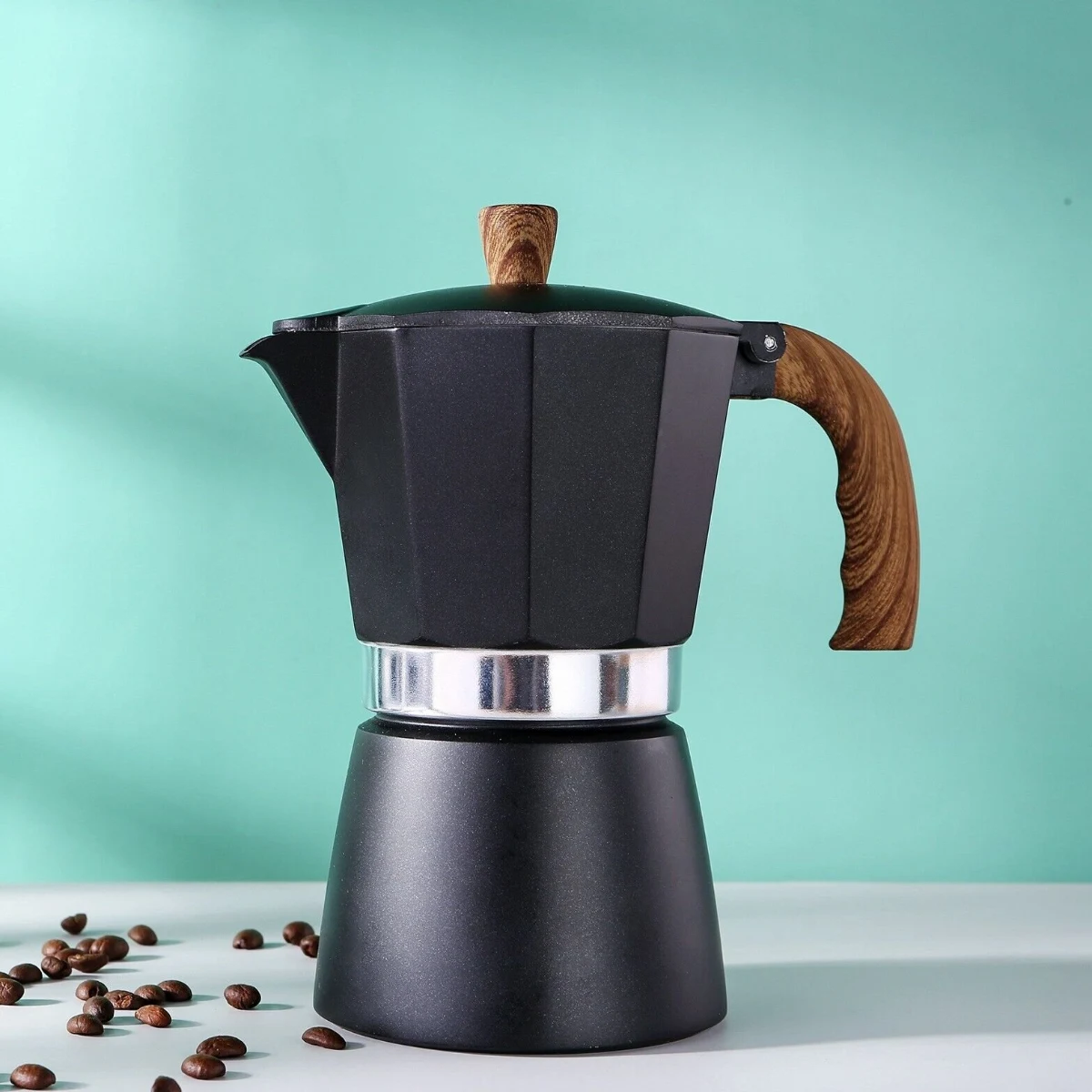 Black Moka Pot 3 or 6 Cup, front view on teal backdrop