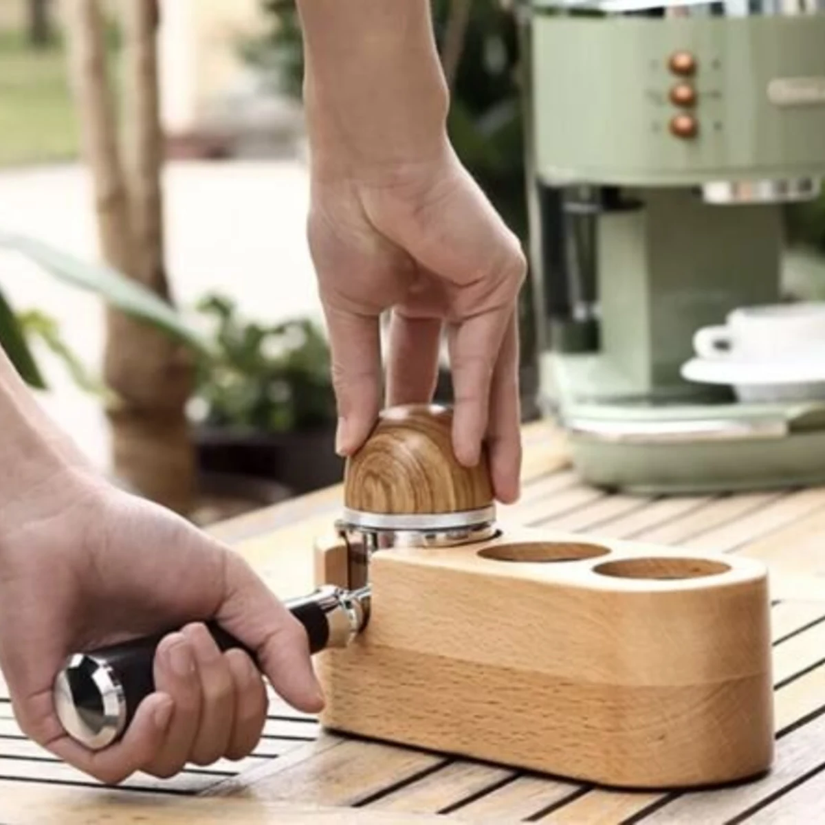 MOJAE 53 mm Tamper Station, in use with portafilter